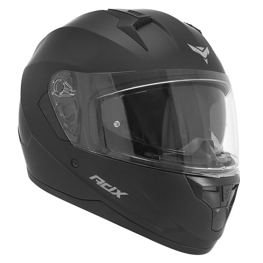 Casque intégral ADX AI450 Noir Mat — vue trois-quarts avant, pare-soleil intégré abaissé derrière l’écran